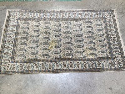 Lot 834 - A Persian designed rug in pale blue and yellow...