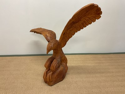 Lot 32 - A large contemporary carved wooden sculpture...