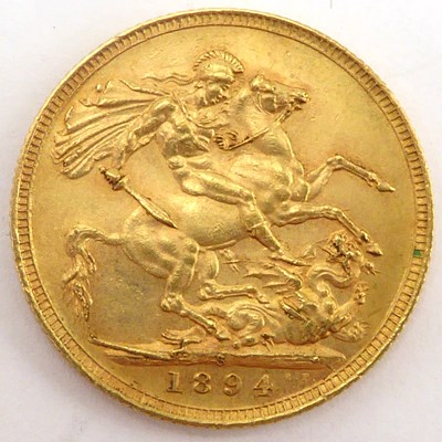 Lot 871 - A Victorian sovereign 1894, old head, George...