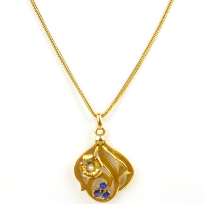 Lot 1080 - A gold floral pendant with seed pearl and...