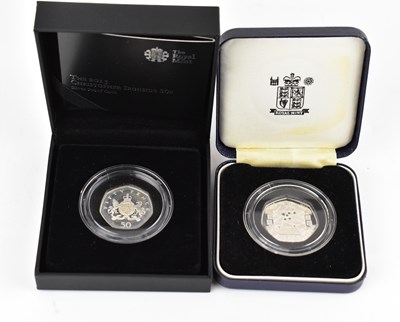 Lot 929 - ROYAL MINT; two collectors' silver 50p coins,...