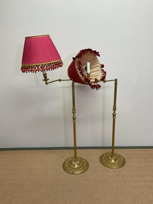 Lot 520 - A pair of brass floor lamps with pleated...