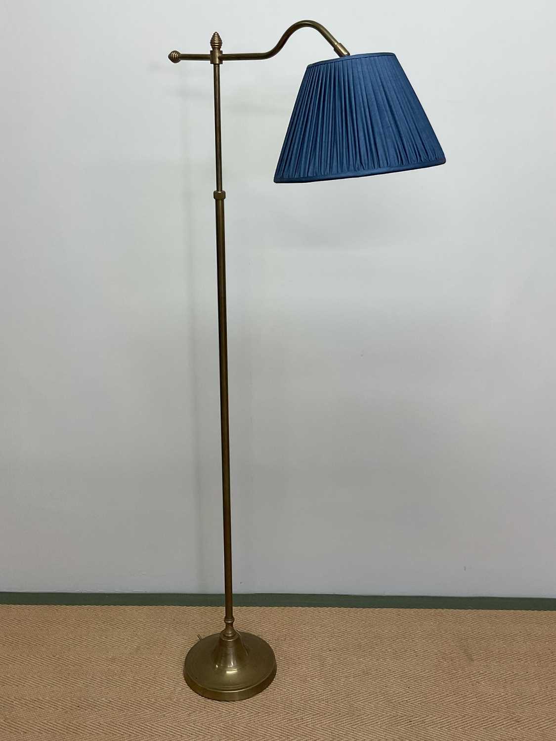 Lot 337 - A brass floor lamp with angled arm, turned...