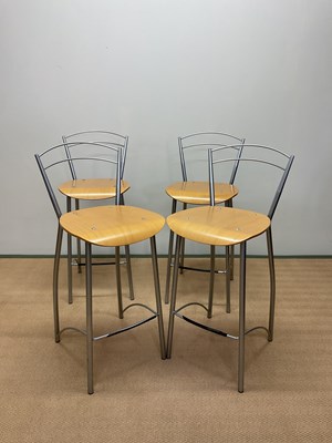 Lot 784 - A set of four contemporary bar stools.