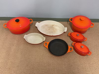 Lot 98 - LE CREUSET: cast iron cooking pots comprising...