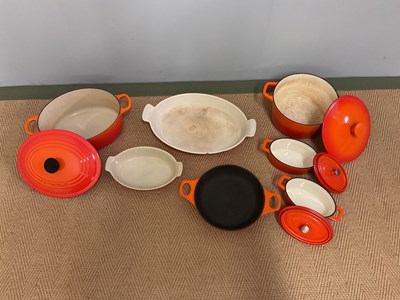 Lot 98 - LE CREUSET: cast iron cooking pots comprising...