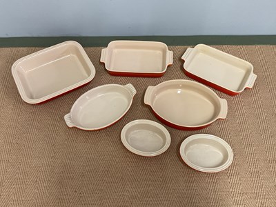 Lot 154 - LE CREUSET; seven ceramic ovenware dishes of...