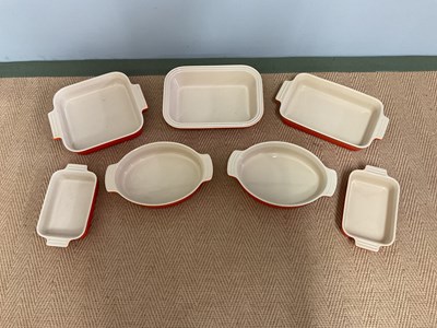 Lot 153 - LE CREUSET; seven ceramic ovenware dishes of...