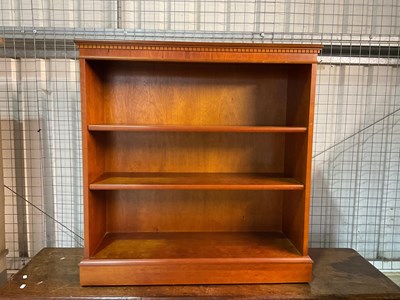 Lot 778 - A reproduction open bookcase with plinth base,...