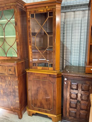 Lot 780 - A reproducion yew wood freestanding corner...