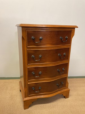 Lot 783 - A small reproduction yew wood serpentine chest...