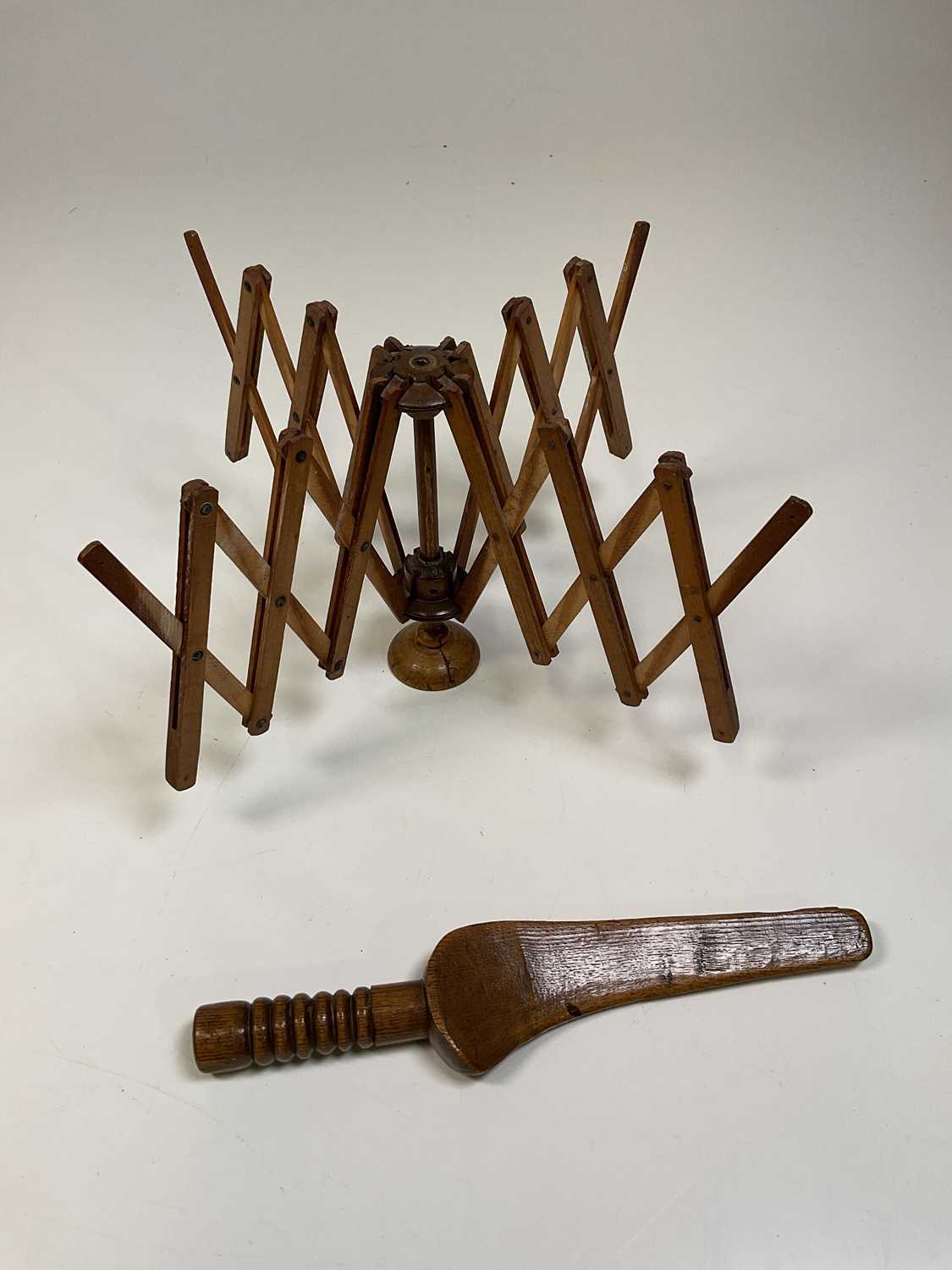 Lot 26 A wooden wool winder and a goose wing