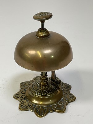 Lot 27 - An early 20th century brass push button bell...