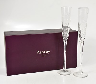 Lot 1575 - ASPREY; a cased pair of glass flutes with...