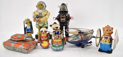 Lot 302 - A group of tinplate toys, to include tinplate...