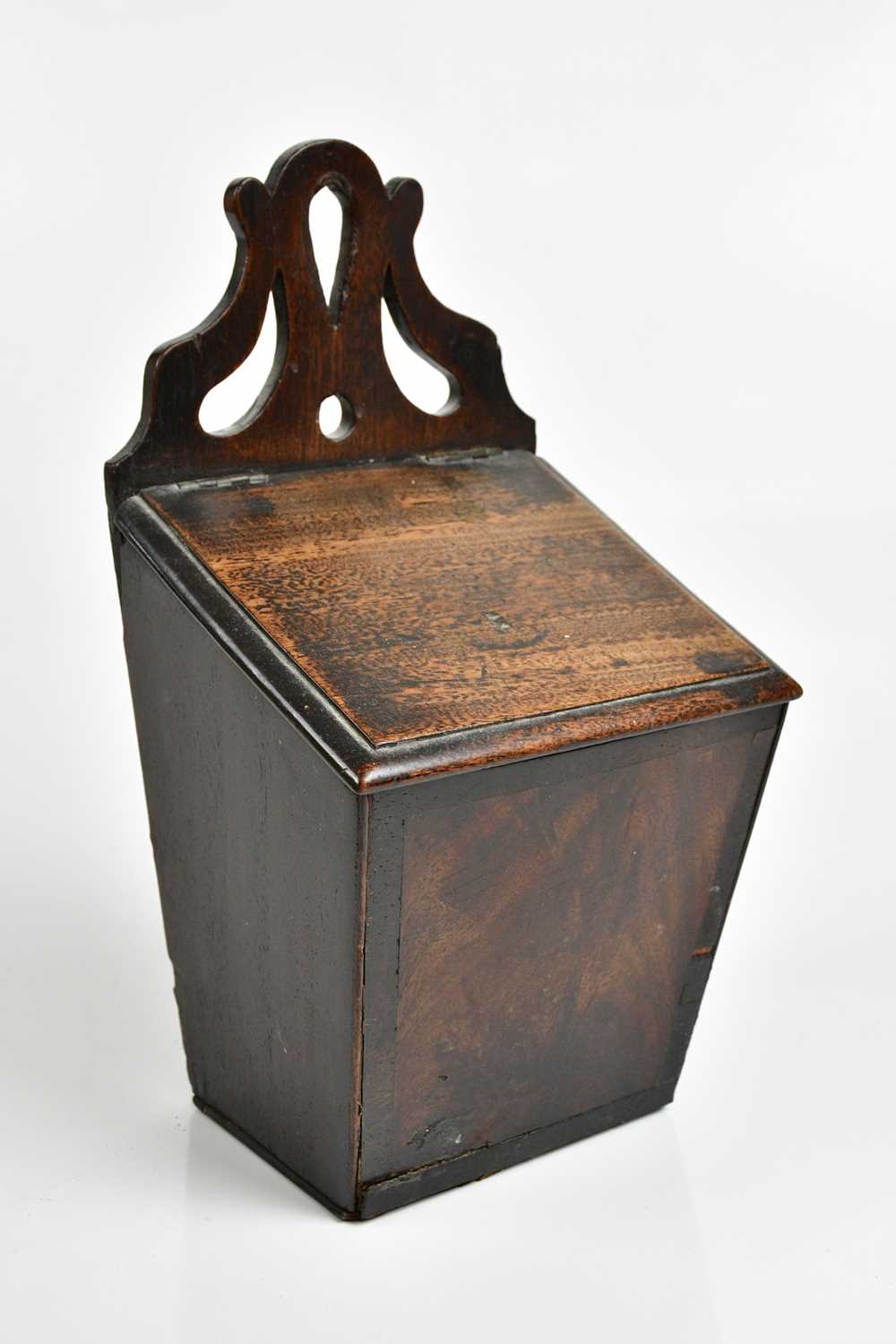 Lot 1026 - An 18th century mahogany salt box with pierced...