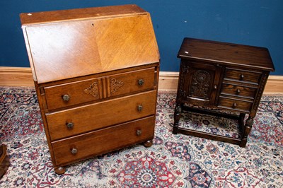 Lot 2438 - A 1940s/1950s oak bureau, the fall front...