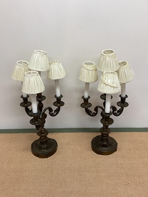 Lot 331 - A pair of French gilt brass table lamps...