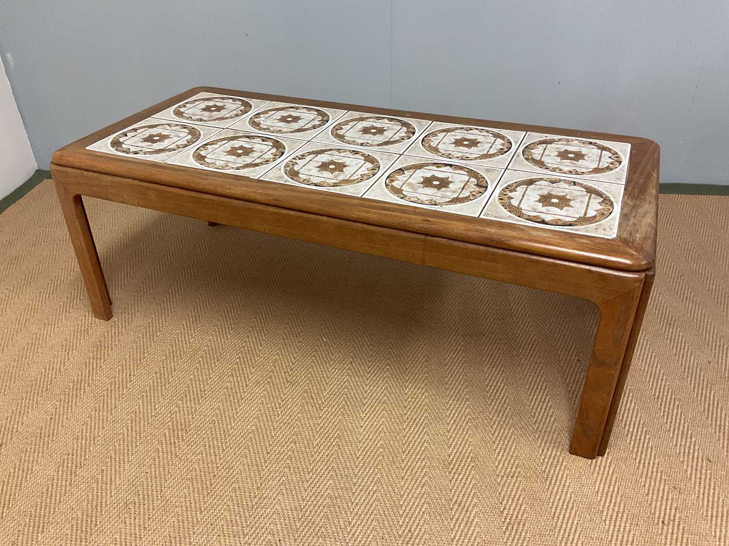 Lot 518 - G-PLAN; a tile top table, height 40cm, width...