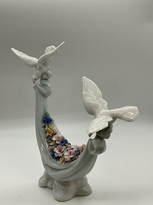 Lot 199 - LLADRO; a figure group, 6579 'Petals of Peace'