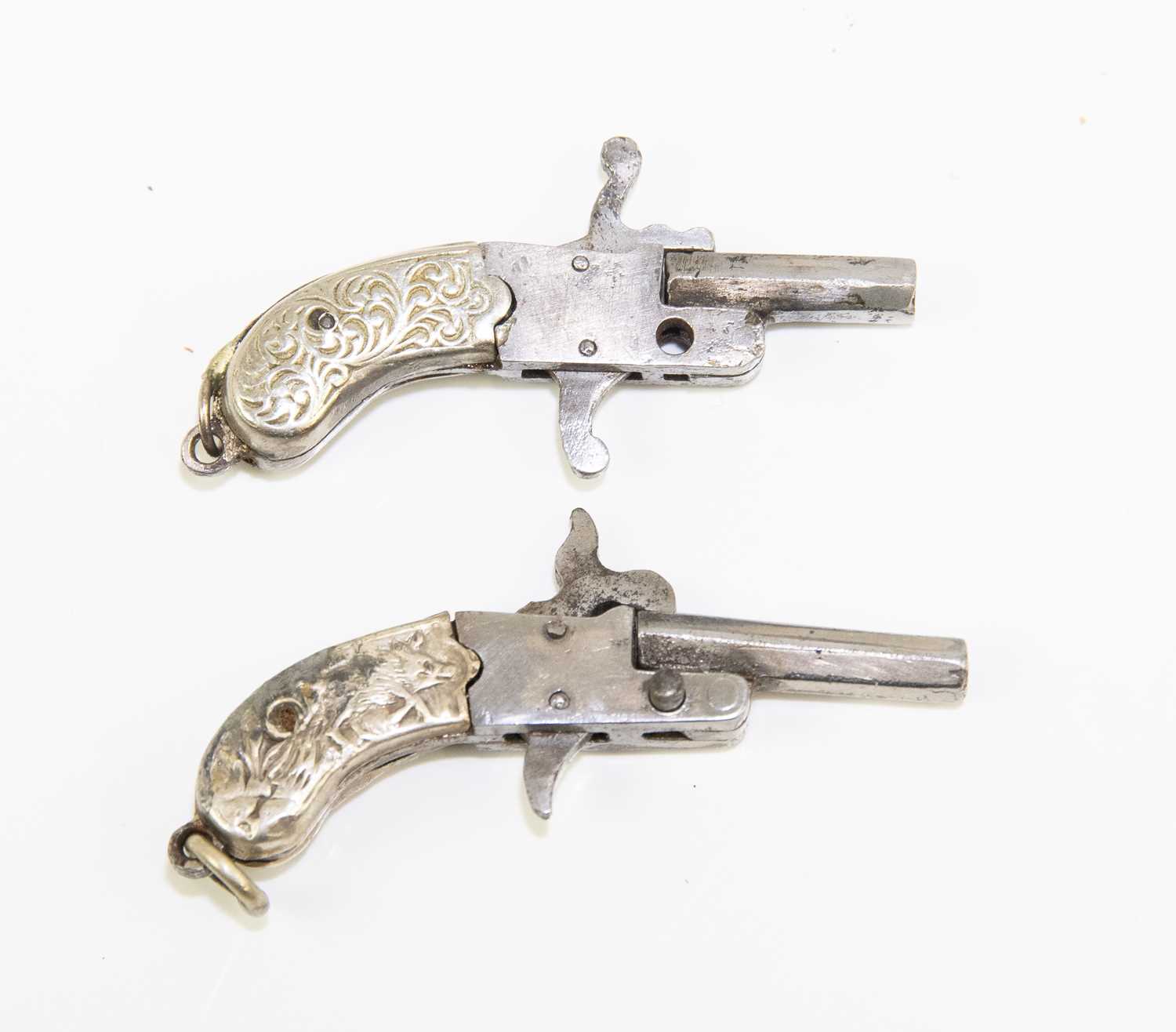 Lot 608 - A cased pair of miniature pin fire pistols,...