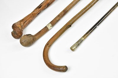 Lot 1024 - Two vintage walking canes, a similar walking...