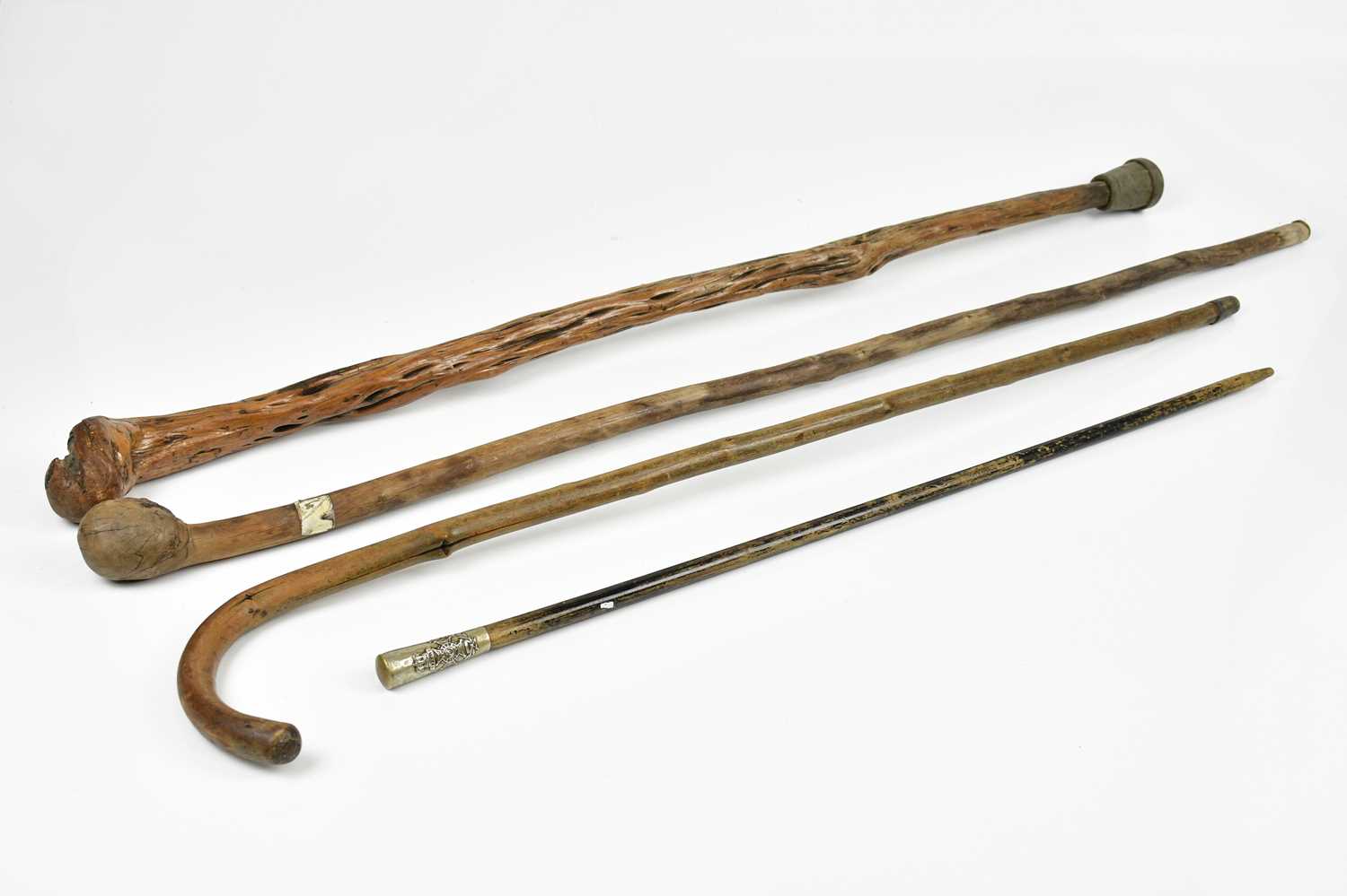 Lot 1024 - Two vintage walking canes, a similar walking...