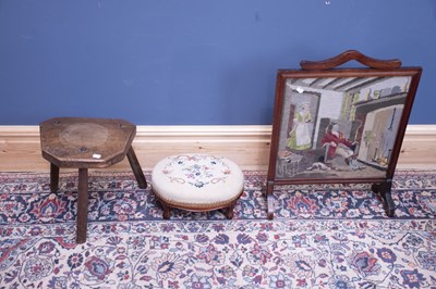 Lot 2456 - An elm foot stool together with a fire screen...