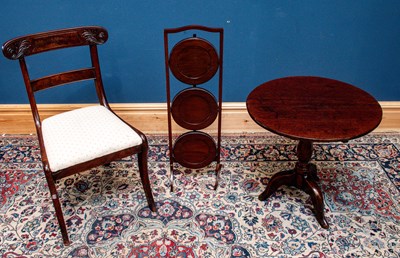 Lot 2457 - A Georgian oak tilt-top tripod table, together...
