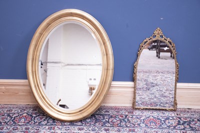 Lot 2592 - A modern gilt frame oval wall mirror, length...