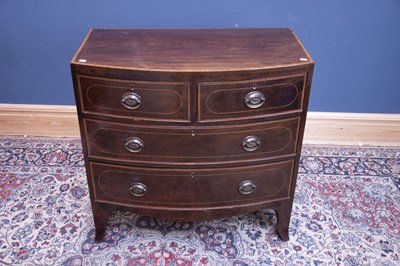 Lot 2434 - A 19th century inlaid mahogany bowfront chest...