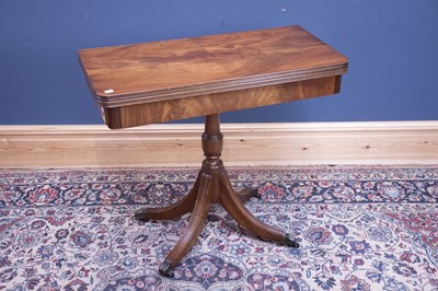 Lot 2429 - A 1950s mahogany fold over swivel-top games...