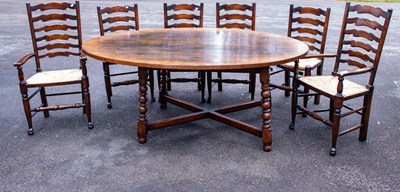 Lot 2575 - A reproduction oak oval top dining table on...