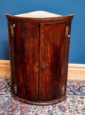 Lot 2559 - A 19th century oak hanging corner cupboard...
