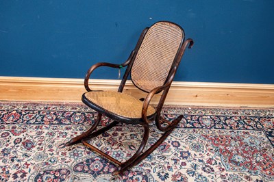 Lot 2498 - THONET; a bent wood cane back and seated...