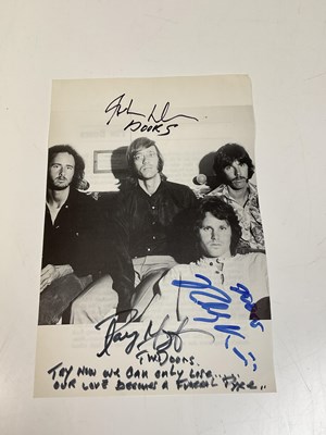 Lot 2092 - THE DOORS; a black and white book page...