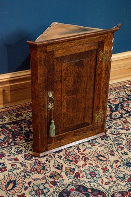 Lot 2560 - A small oak straight front wall mounted corner...
