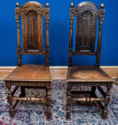 Lot 2450 - A pair of 20th century carved oak hall chairs,...