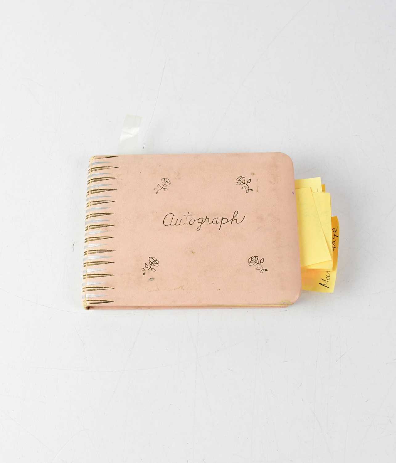 Lot 252 - A partially filled autograph book with...