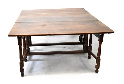 Lot 45 - A 19th century oak gateleg drop-leaf supper...