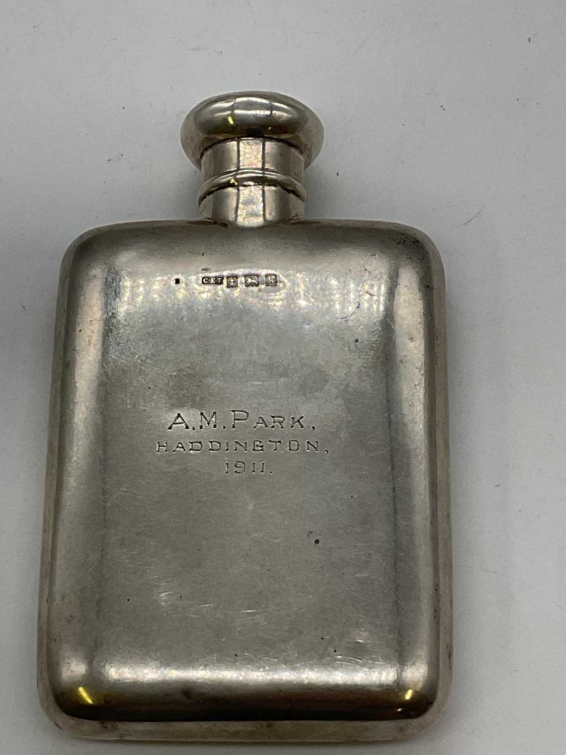 Lot 1097 - An Edwardian hallmarked silver hip flask