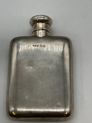 Lot 1097 - An Edwardian hallmarked silver hip flask with...