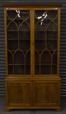 Lot 42 - A late 19th century walnut bookcase, the upper...