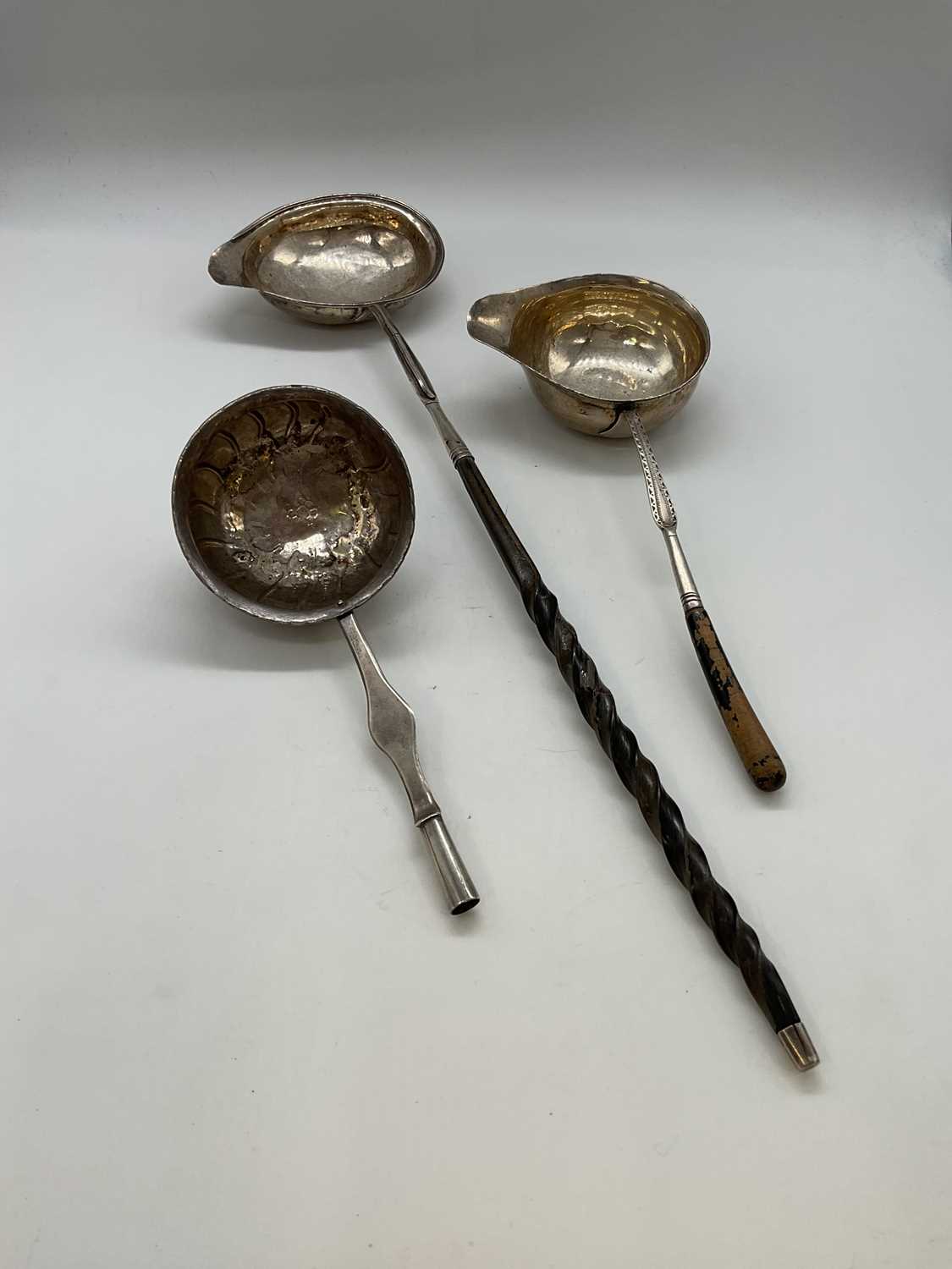 Lot 1127 - A Georgian toddy ladle with white metal bowl...