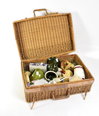 Lot 115 - A vintage wicker picnic basket containing a quantity of mixed ceramics