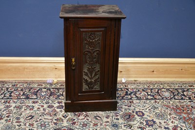 Lot 2493 - A Victorian carved walnut pot cupboard, the...
