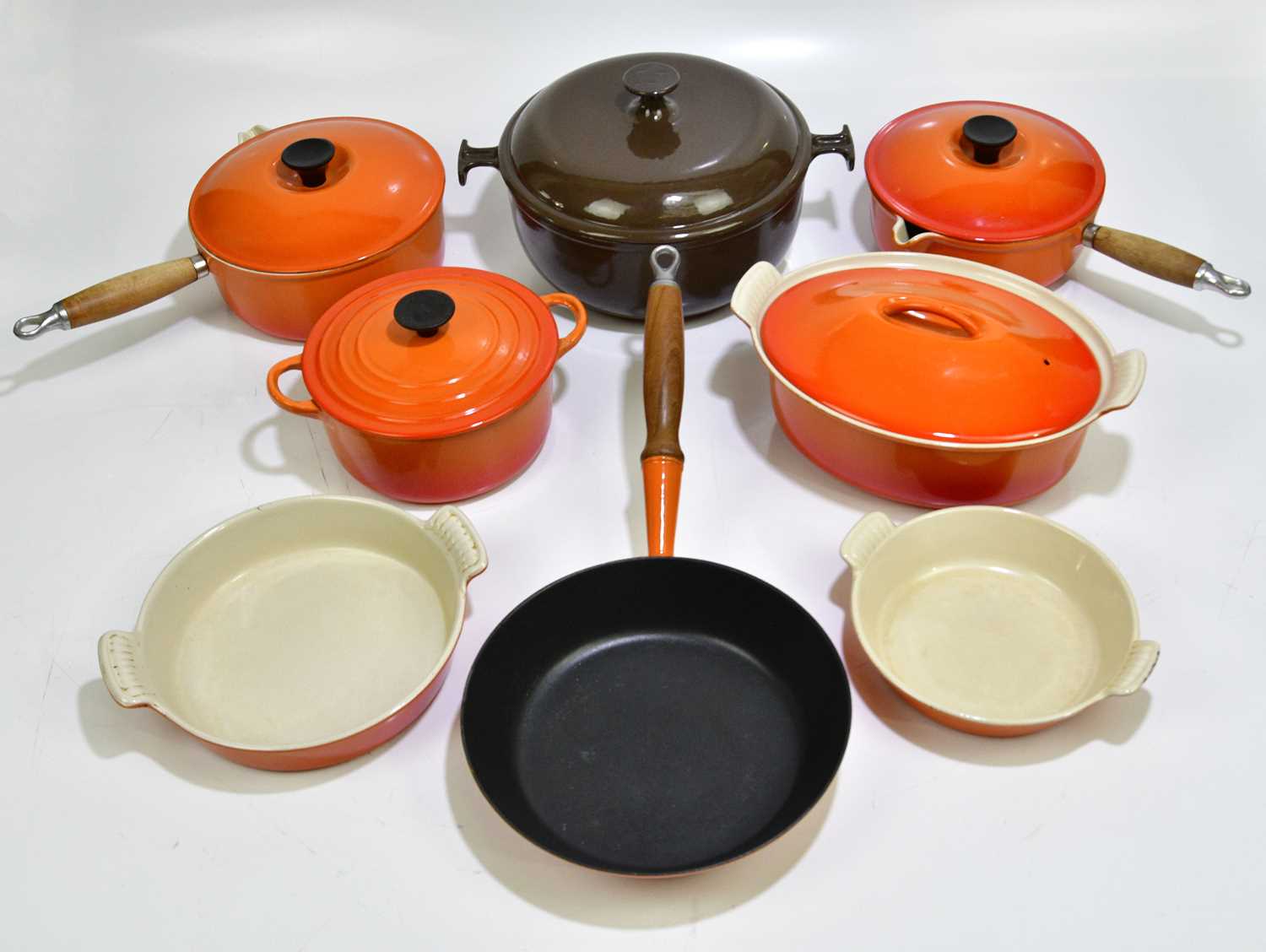 Lot 2304 - LE CREUSET; a collection of cast iron pans, a...