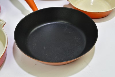 Lot 2304 - LE CREUSET; a collection of cast iron pans, a...