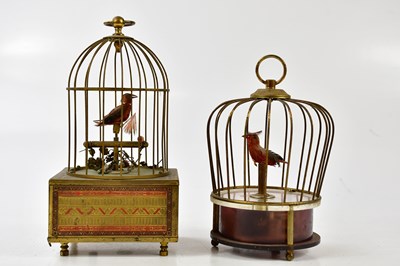 Lot 1063 - Two vintage automaton singing birds in bird...