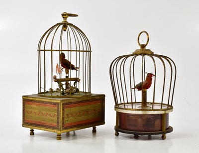 Lot 1063 - Two vintage automaton singing birds in bird...